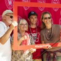 Jack Meyer, along with his mother and grandparents, smile for the camera in a photo booth outside Union South.