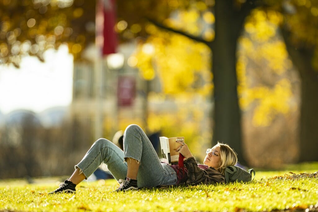 Is it just our imagination, or does fall make Bascom Hill — the summer frisbee-tossing and sunbathing crowds having thinned — a more relaxing place to stretch out with a good book? Student Karlie Bonnell votes yes.