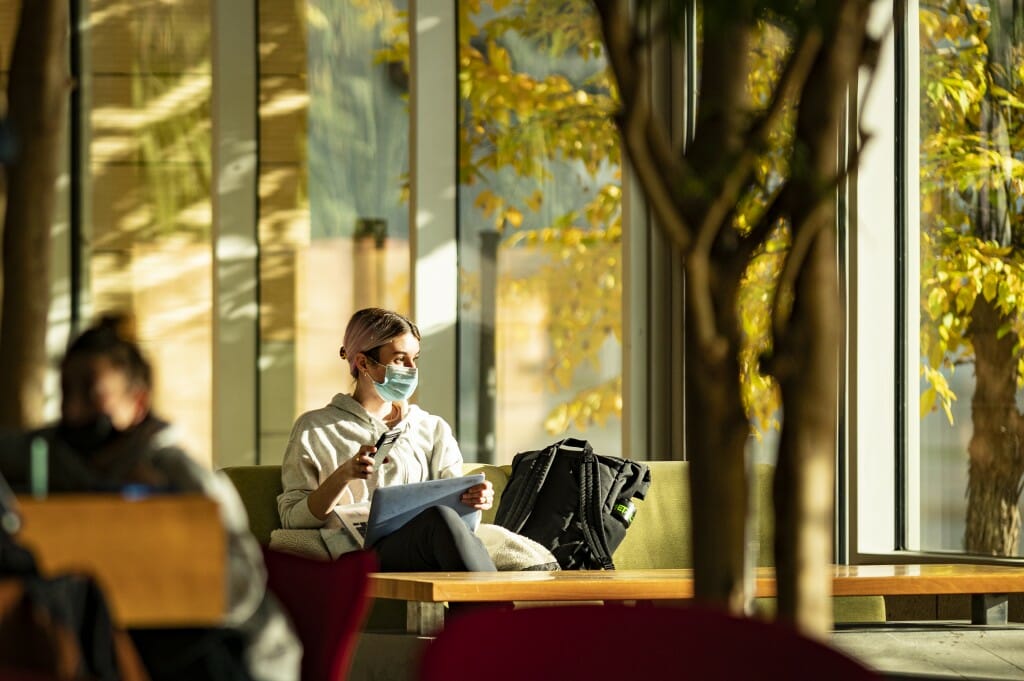 Sweeping views through the windows of the Discovery Building bring fall color inside, providing an inspiring mood for a reflective moment.