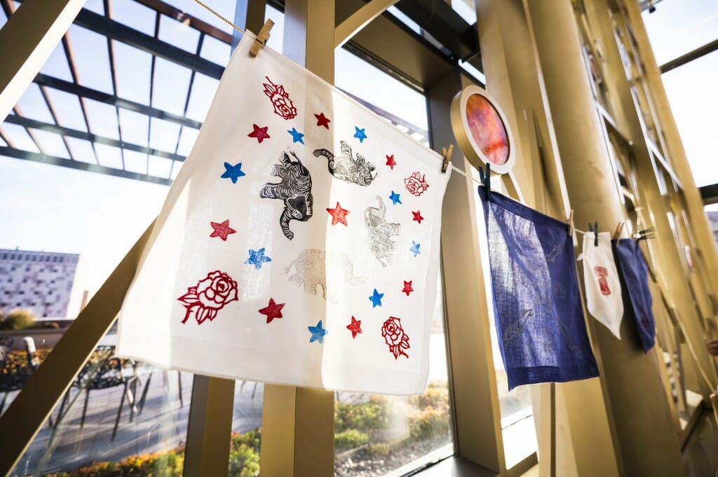 Finished block printed handkerchiefs hang to dry.