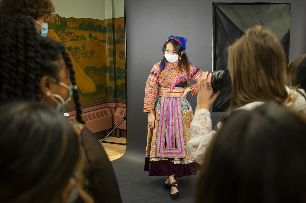 A woman poses for photos.