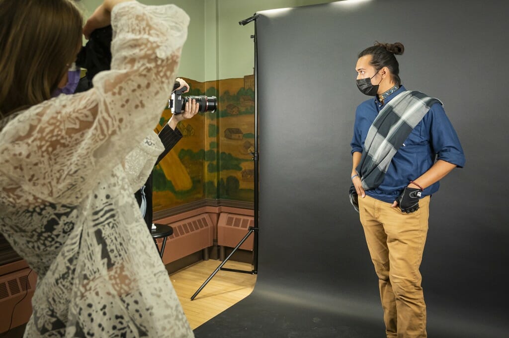 A man stands up for a photo.