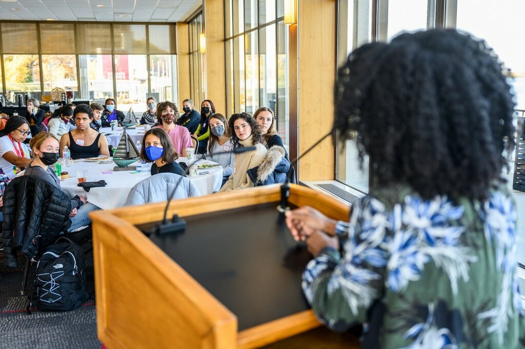 Gyasi speaking at a podium to an audience