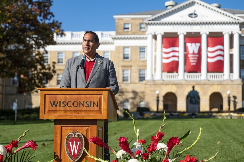 Aaron Bird Bear speaking at podium