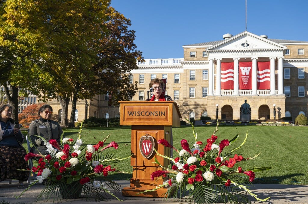 Blank speaking at podium