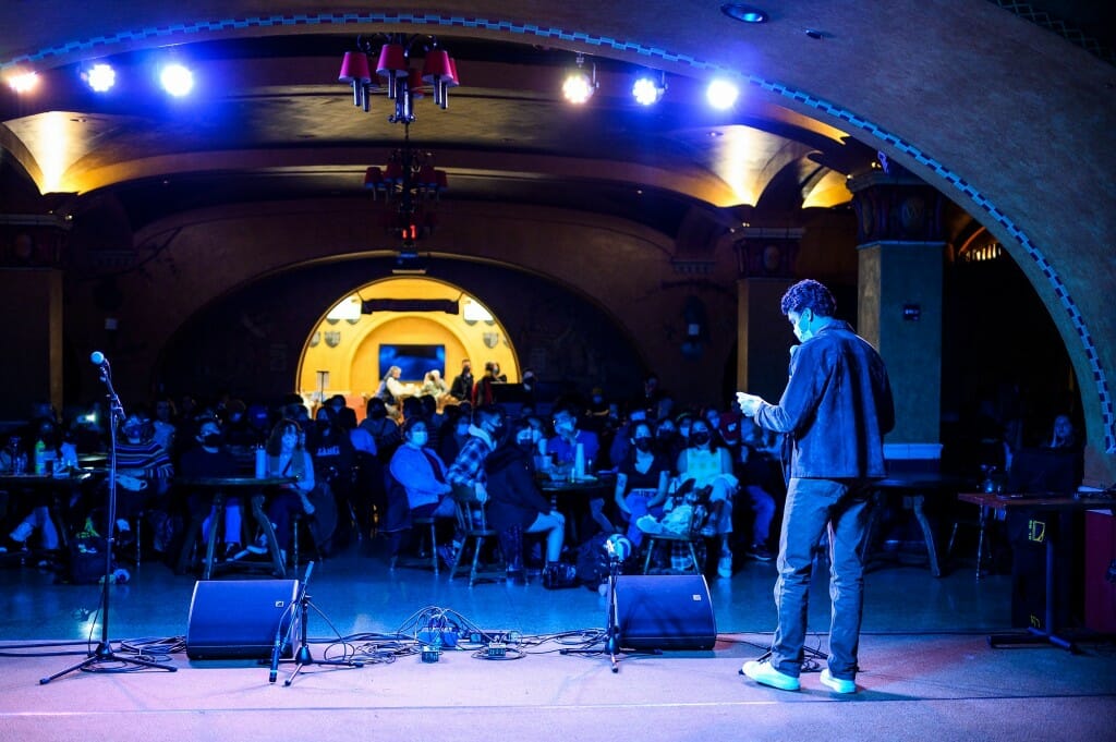 Student Milan Stolpman performs a spoken-word piece.