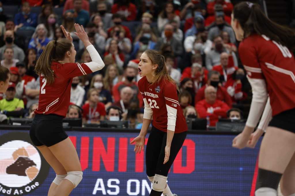 Julia Orzol (22) and Sydney Helley celebrate a point.