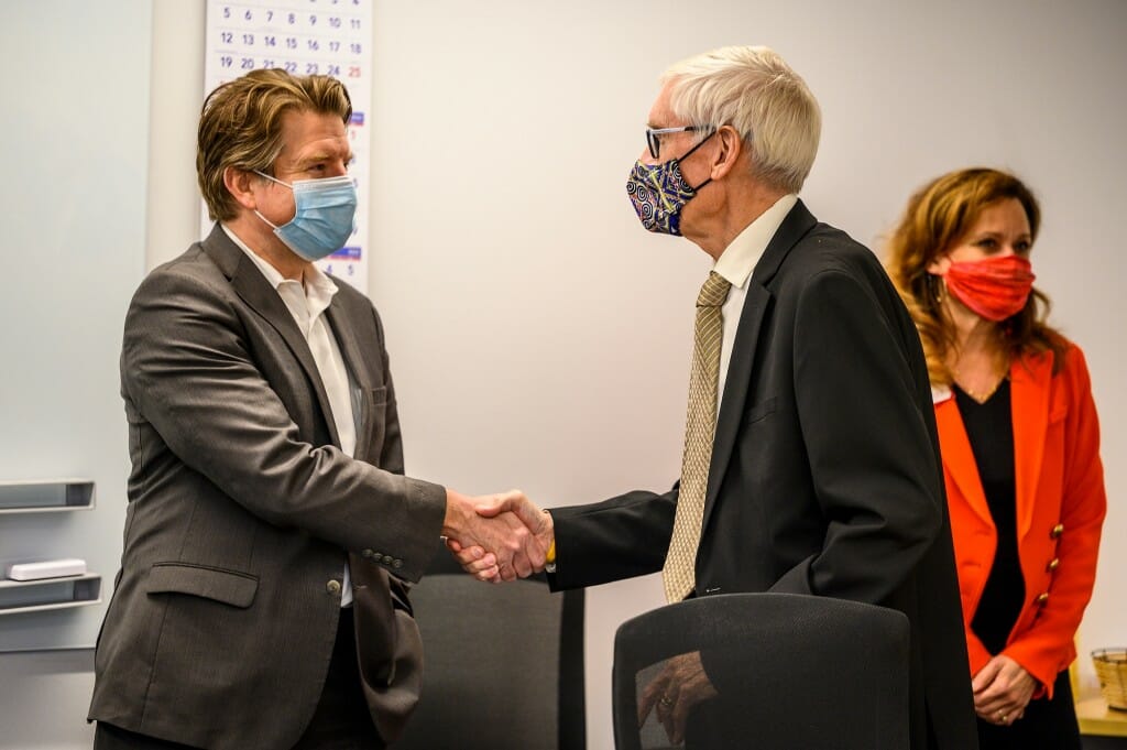 Olver and Evers shaking hands