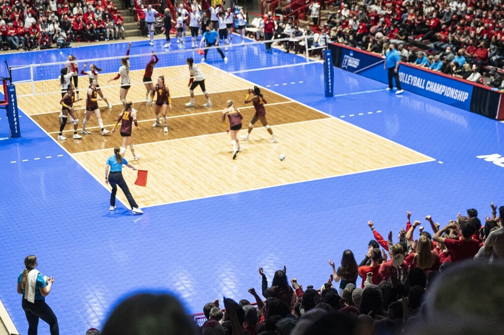 Fans cheer as the Badgers score during the match.