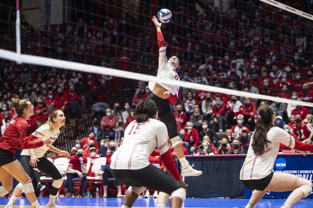 Loberg reaches for the ball over the net