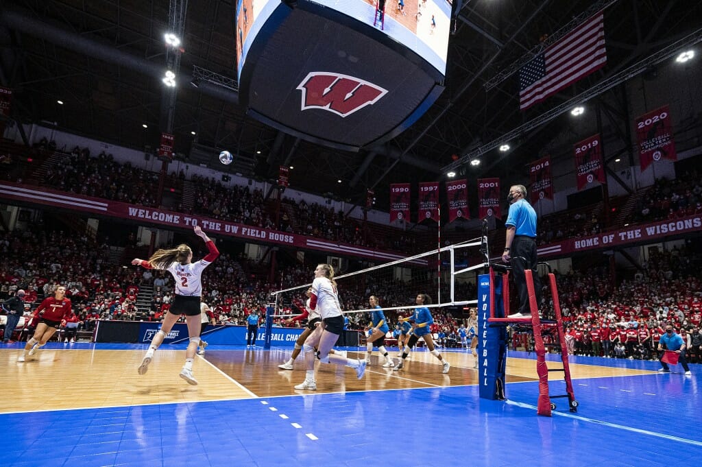 Wisconsin player in position to hit the ball