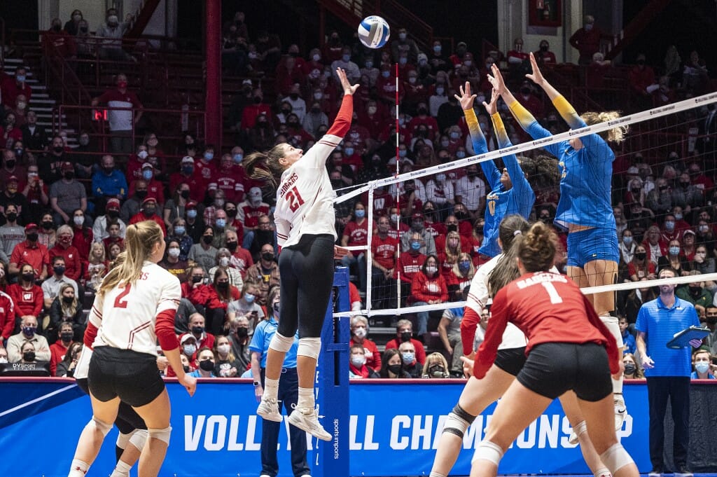 Loberg reaches for the ball over the net