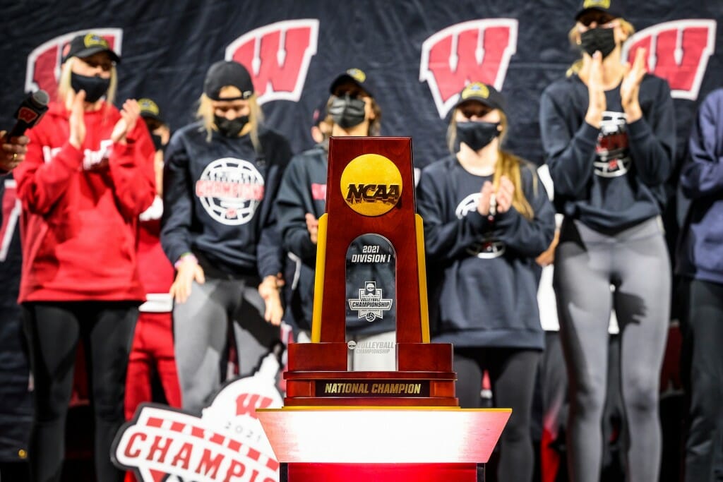 Players standing behind the trophy onstage