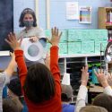 Haddie speaking to school children in a classroom