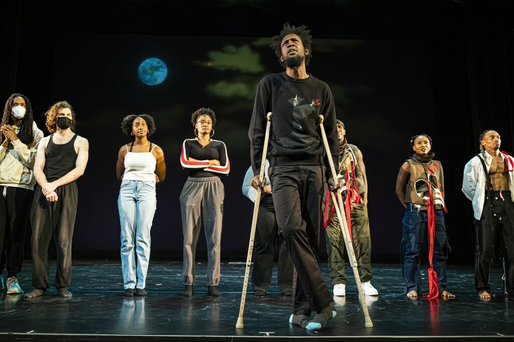 With the cast behind him, director of the Division of the Arts and dance professor Chris Walker speaks during the event.