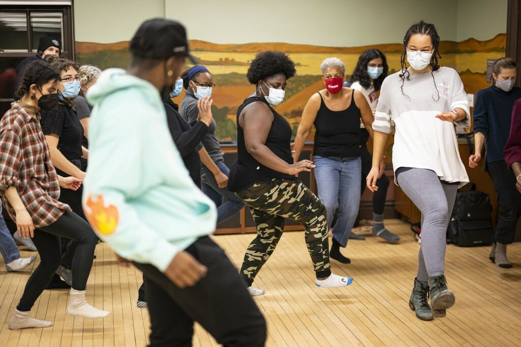 HitmakerChinx (left) offers tips to participants as he leads them in a dance.