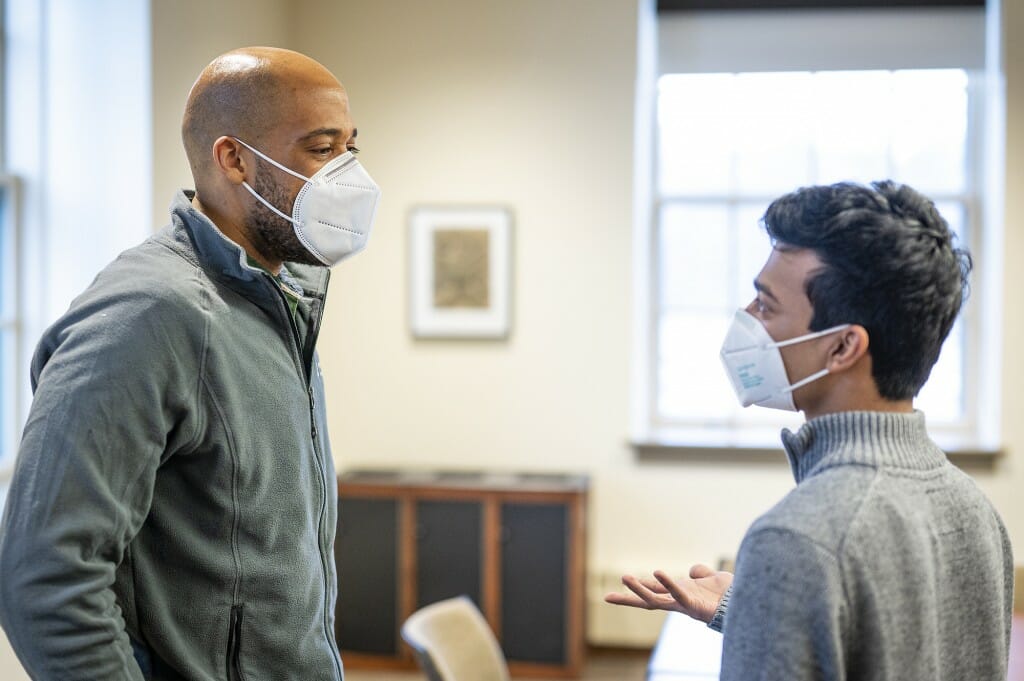 Barnes talking with a student