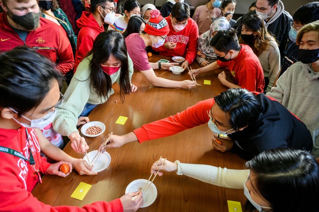 Photo: A group of students around a table.