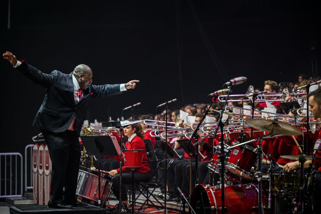 Band director Corey Pompey enthusiastically leads the band during dress rehearsal on Thursday night.