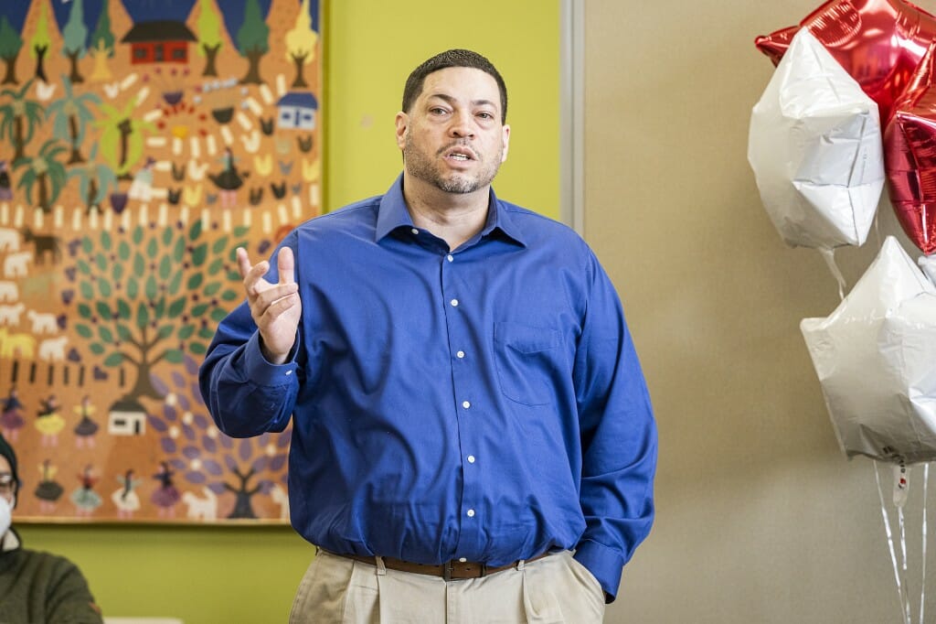 Mark Español standing and gesturing while speaking to audience