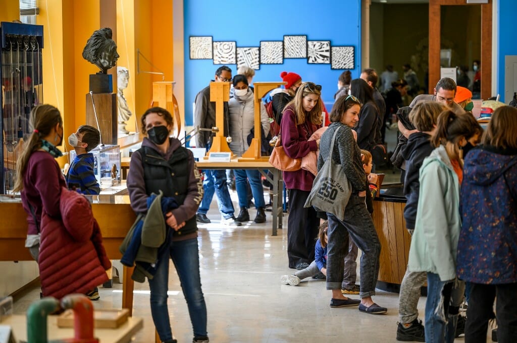 Visitors explore the Leonard R. Ingersoll Physics Museum in Chamberlin Hall.