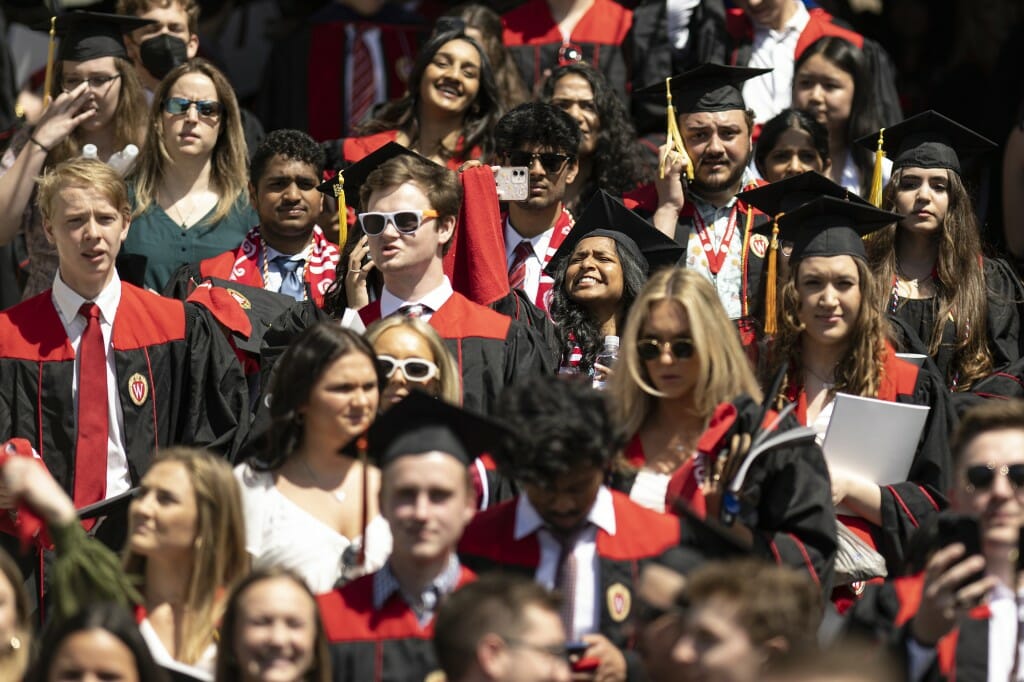 A small group of graduates in the crowd