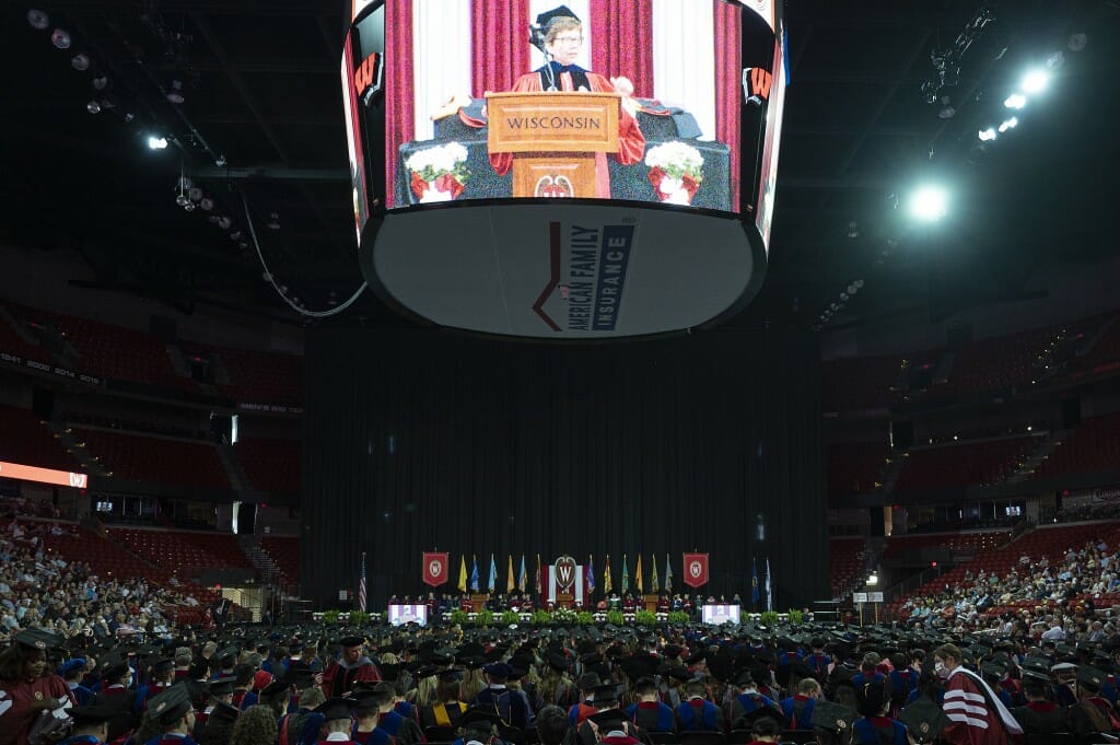 Wide view of the interior of the Kohl Center with Blank appearing on jumbo video monitor on ceiling