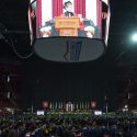 Wide view of the interior of the Kohl Center with Blank appearing on jumbo video monitor on ceiling