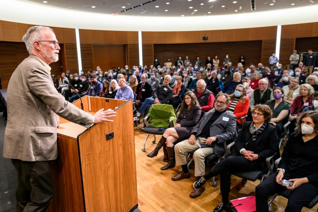 Wide view of audience listening to Cronon at podium