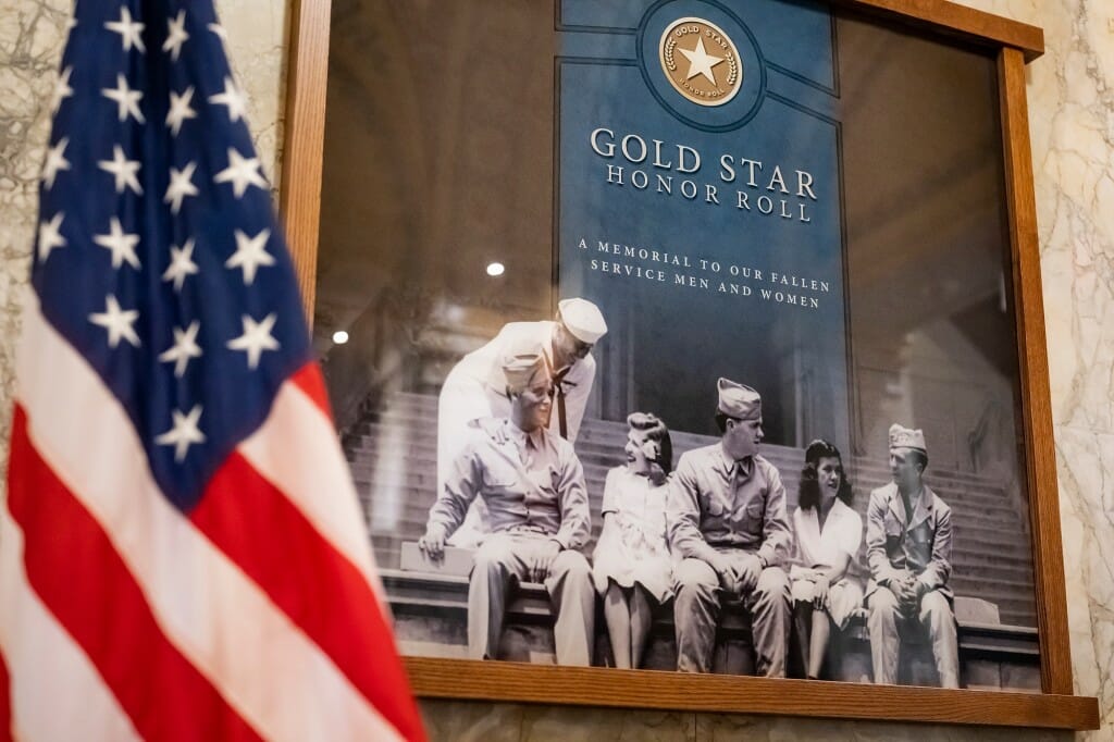 Closeup of a video display of service members in uniform