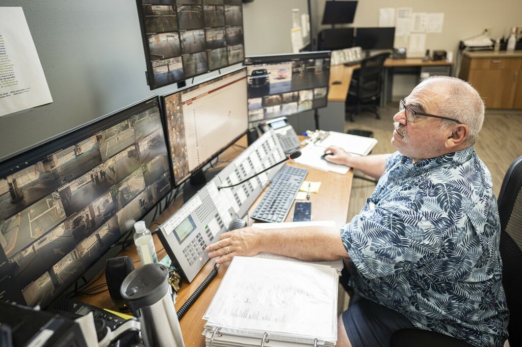 Gorman sitting at a communications terminal