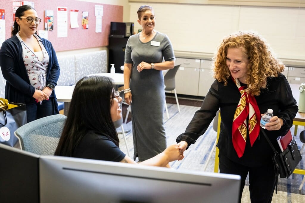 Mnookin shaking hands with a student