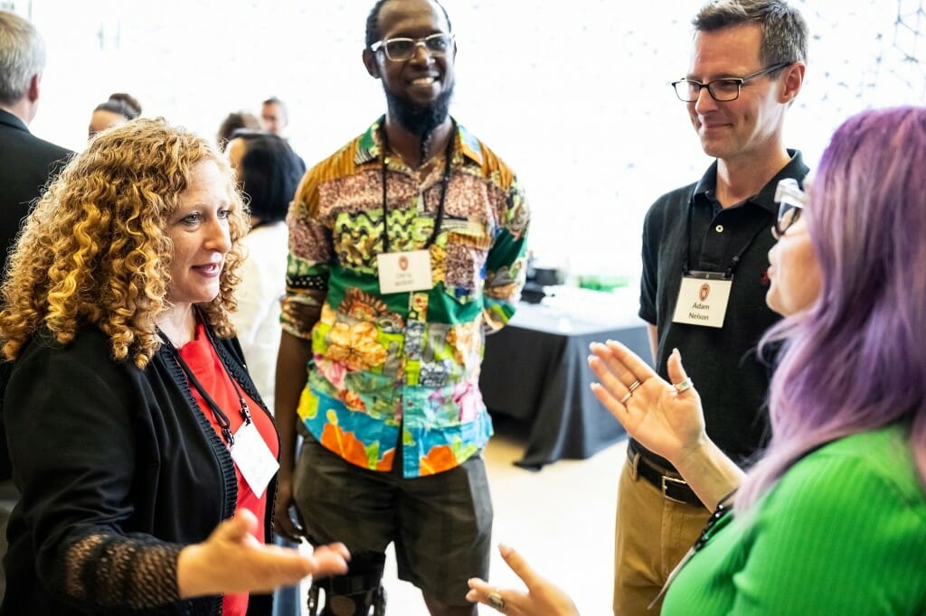 Several people chatting at a reception