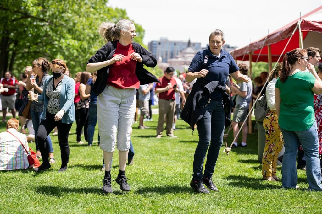 Two people dancing together on the lawn