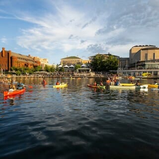 The water of Lake Mendota, with the Terrace stage in the far background.