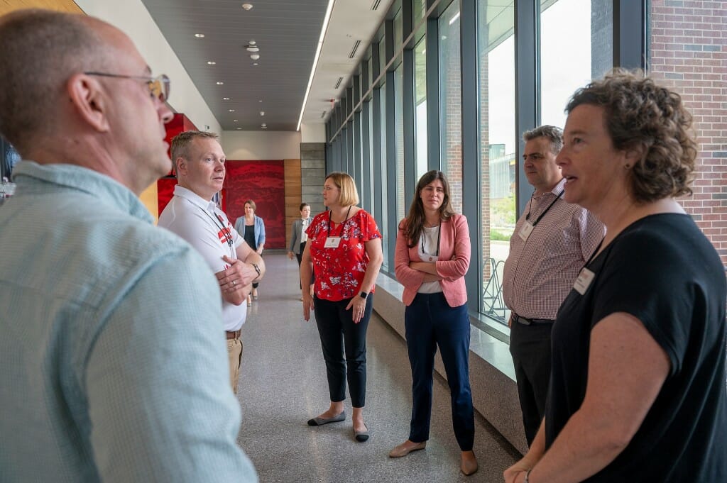 From left to right foreground, Mark Rickenbach, senior associate dean at CALS; Mike Lenn, director of UW–Madison Federal Relations; Dianne Nellor, majority clerk for the USDA Senate Agriculture Appropriations Subcommittee; Morgan Ulmer, minority clerk for the subcommittee; Patrick Carroll, USDA senate staff member; and Heidi Zoerb, CALS associate dean for external relations, talk before a tour of the Meat Science and Animal Biologics building.