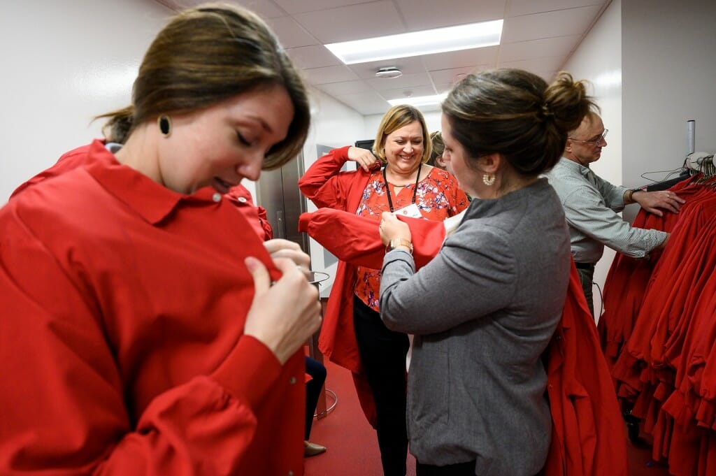 From left to right, Elizabeth Dent, senate USDA staff; Dianne Nellor, majority clerk; Hannah Chauvin, USDA staff; and Mark Rickenbach, senior associate dean for the College of Agricultural & Life Sciences, suit up with PPE before a tour of the Meat Science and Animal Biologics building.