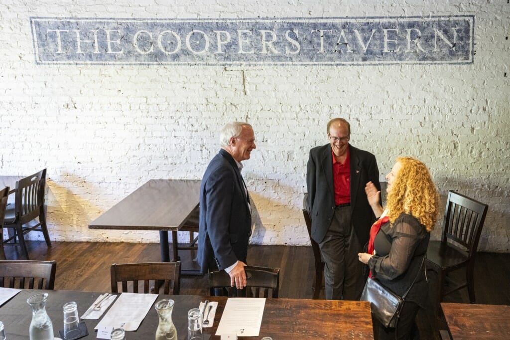 Chancellor Mnookin stands and greets local business leaders