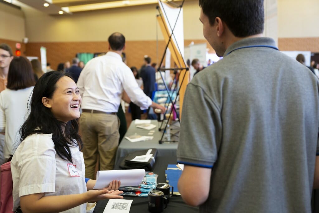 Senior Maima Syakhroza talks to a recruiter from Analog Devices.