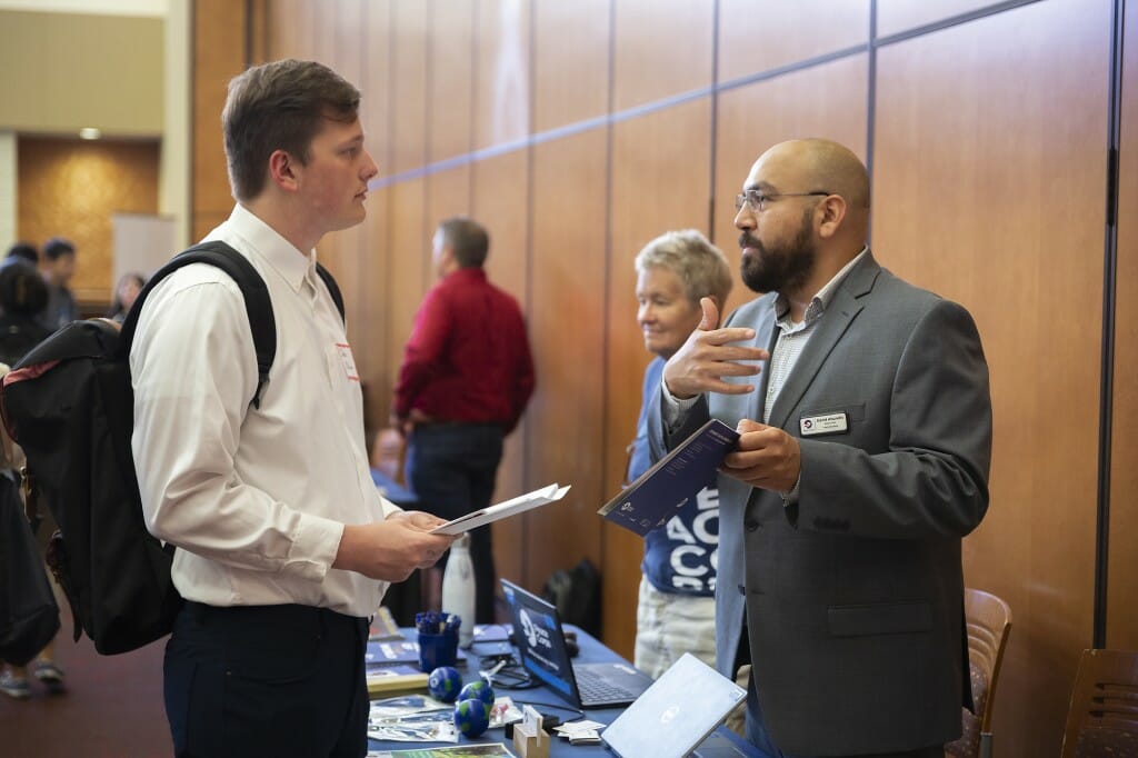 A Peace Corps recruiter explains options to senior John Allison.