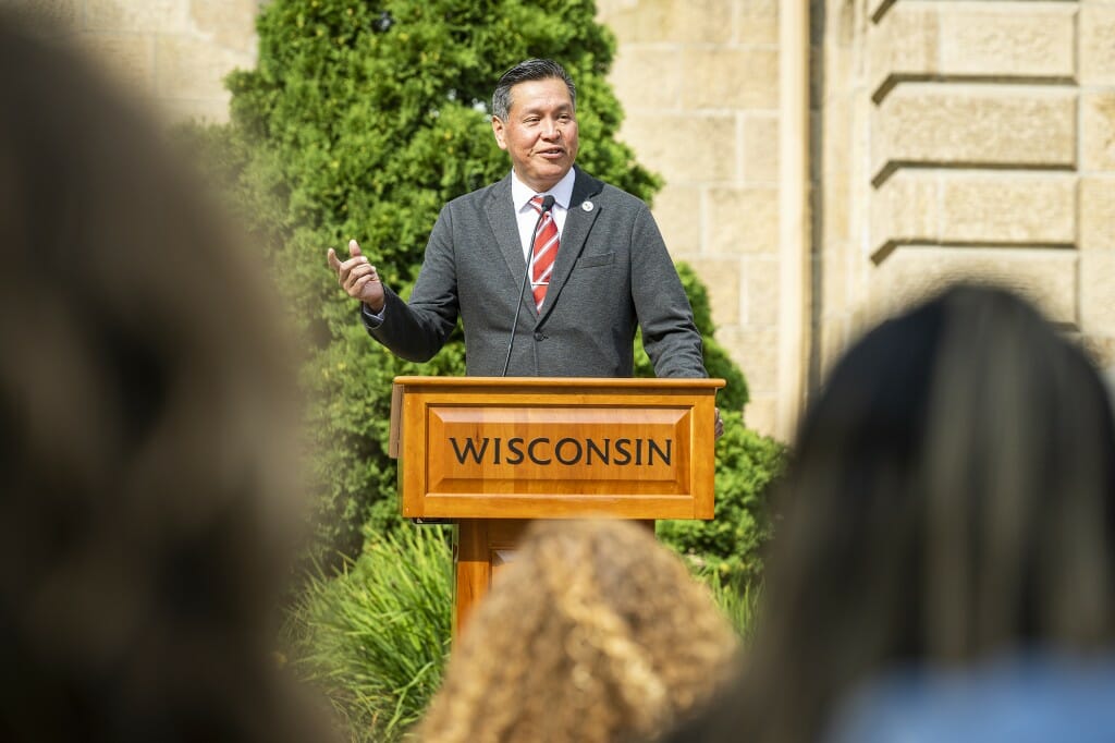 A man stands at a podium and speaks.