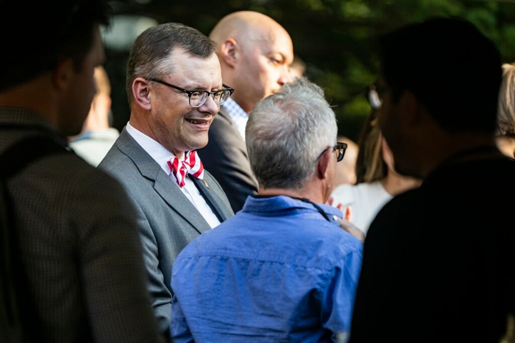 Jake Baggot, associate vice chancellor for heath services, talks with others at the event.