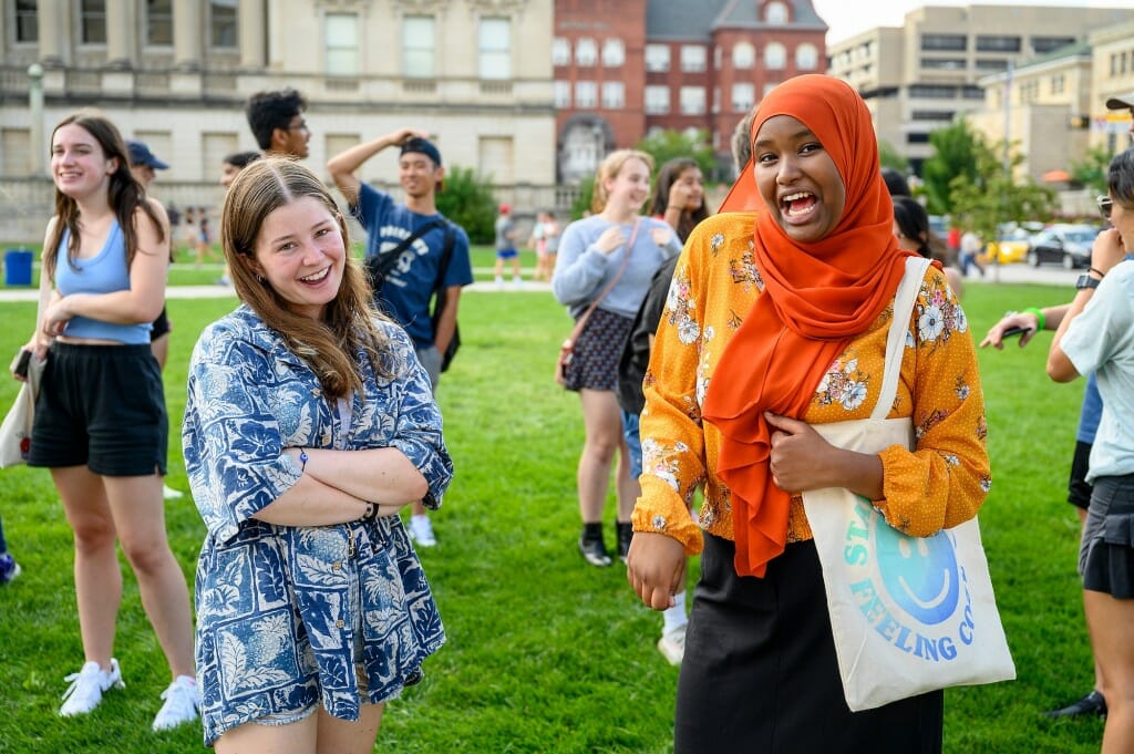 Getting into the spirit of the event, two new students sing a song to each other.