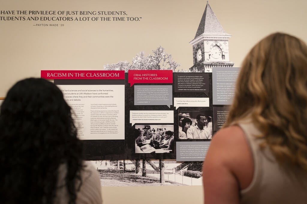 People look at an exhibit titled 