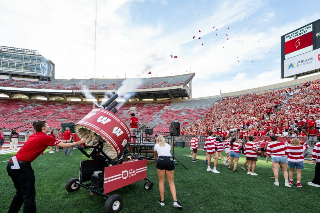 A t-shirt cannon fires rolled-up shirts into the crowd.