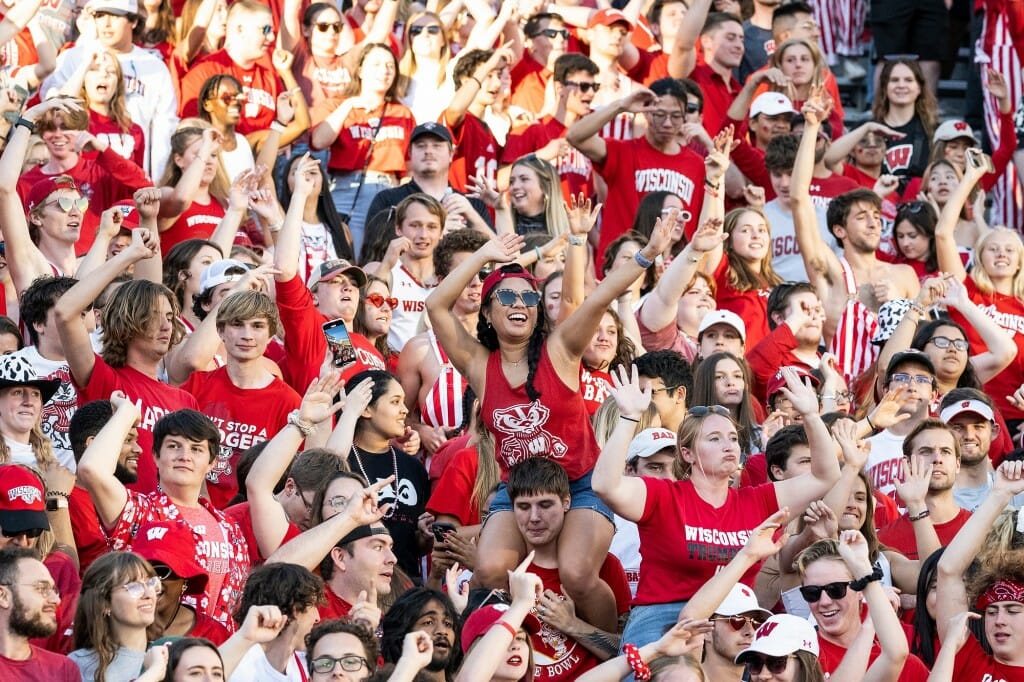 Badger fans cheer and dance to the song 