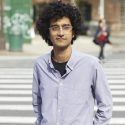 Latif Nasser stands in front of a city street crosswalk