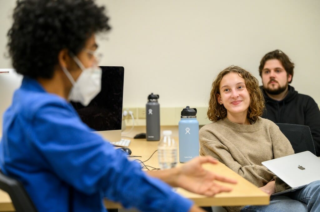 Students in Creative Nonfiction (J405)  Sophia Vento and Ethan Wollins listen to Latif Nasser as he shares his tips for finding interesting stories (which included trolling Wikipedia, signing up for lots of science newsletters, talking to lots of people, and doing deep dives into Google to find answers to questions).