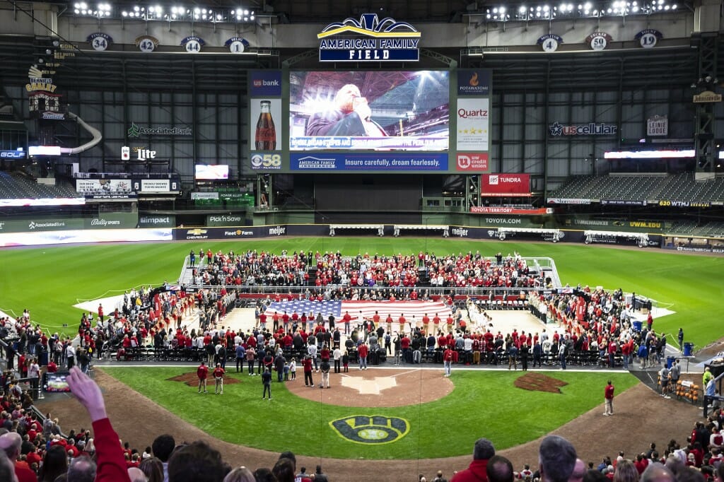 UW–Madison student veterans unfurl a court-size American flag before the start of the men's basketball game.