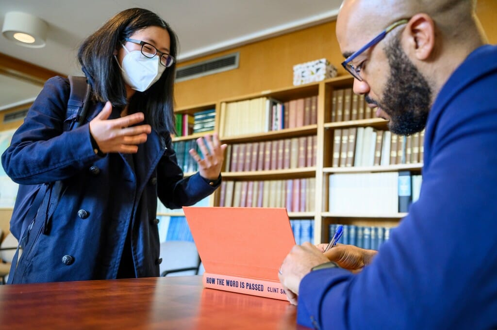 Emily Tran, a sixth year PhD student, gets Smith to sign her copy of “How the Word Is Passed.